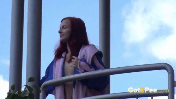 Watch this kinky redhead get a public surprise while peeing in the city - sexu.com on poweredporn.com