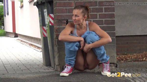Lara Braun relieves herself in public with a walk and a pull - sexu.com on poweredporn.com