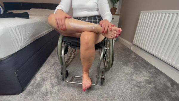 Wheelchair Girl Massaging Legs And Feet After Work - hclips.com on poweredporn.com