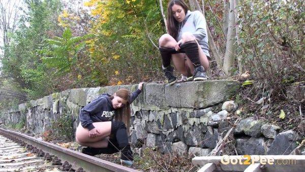 Brunette girls get desperate for a public pee session in the railway - sexu.com - Czech Republic on poweredporn.com
