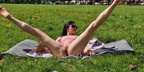 Brunette milf flashing pussy and pissing in a public park - anysex.com on poweredporn.com