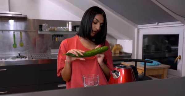 A cute girl peels a cucumber for her older man in a sensual scene. - alphaporno.com on poweredporn.com